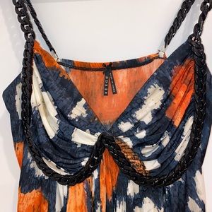 Sexy summer shirt with plastic chain straps going around bust. Size M